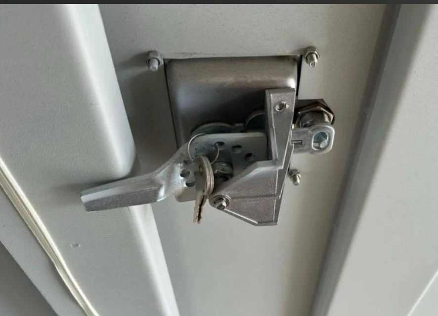 9ft Container Office – Side Entry and Barred Window – close-up of metal door latch with hanging keys