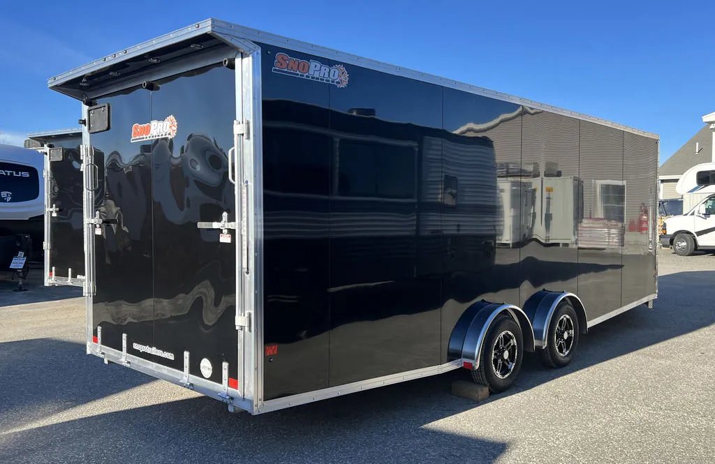 2024 Sno Pro 22 ft Snowmobile Trailer – Extra Height – Rear three-quarter view from the passenger side showing the long black body