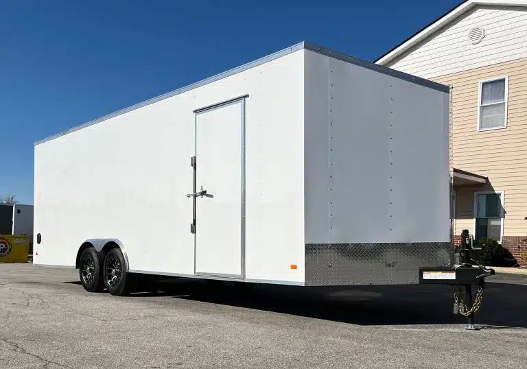 2026 Millennium 24 ft Car Hauler – White Hero – Side view of the white enclosed trailer with side entry door and hitch