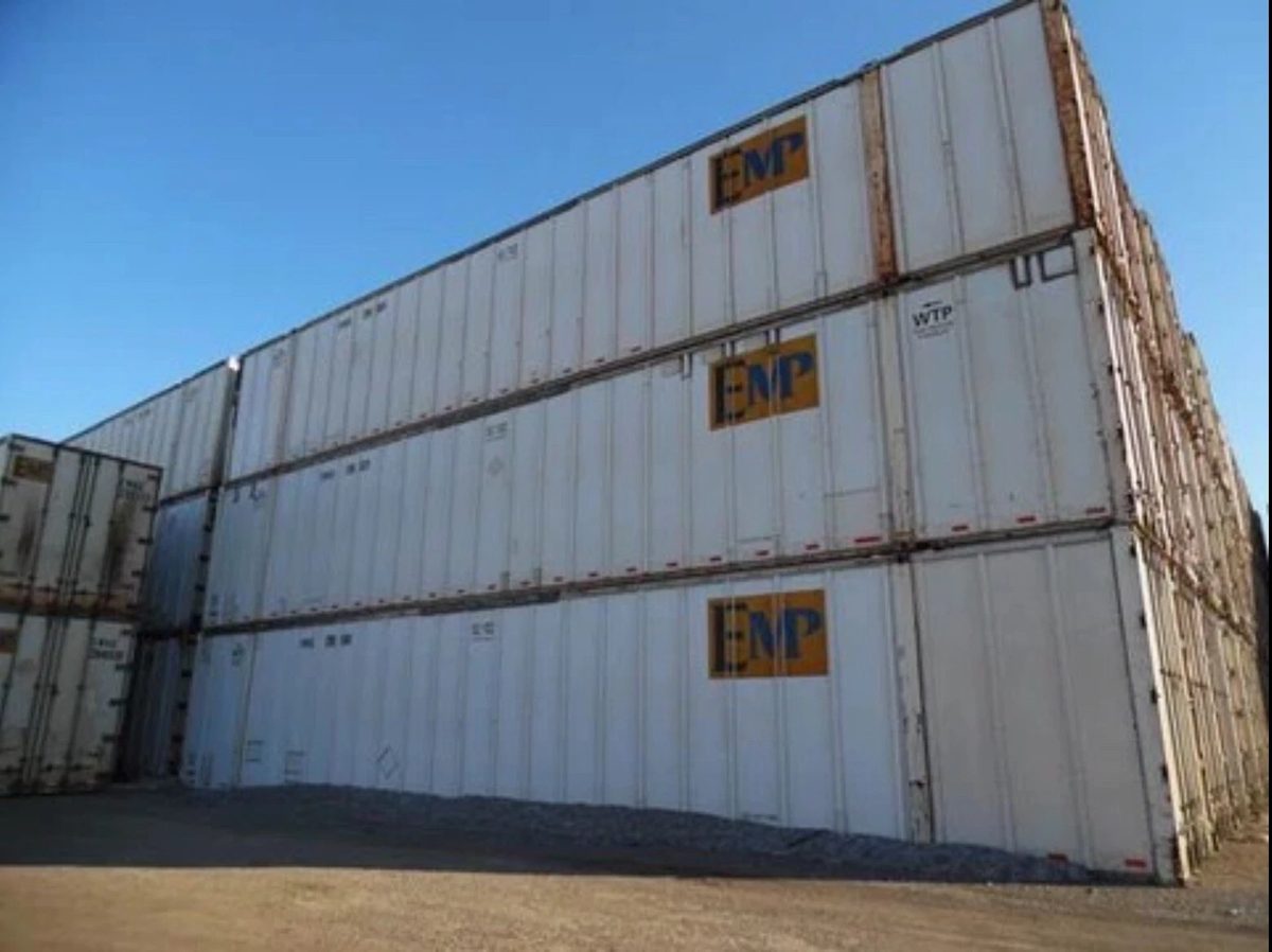 53ft High Cube Shipping Container – Aluminum Construction – weathered shipping containers stacked three high in a yard