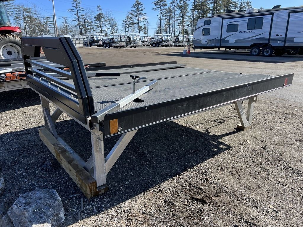 2023 Sno Pro 8 ft Sled Deck – Sliding Sides – Front corner view showing the tie-down bars on the deck surface
