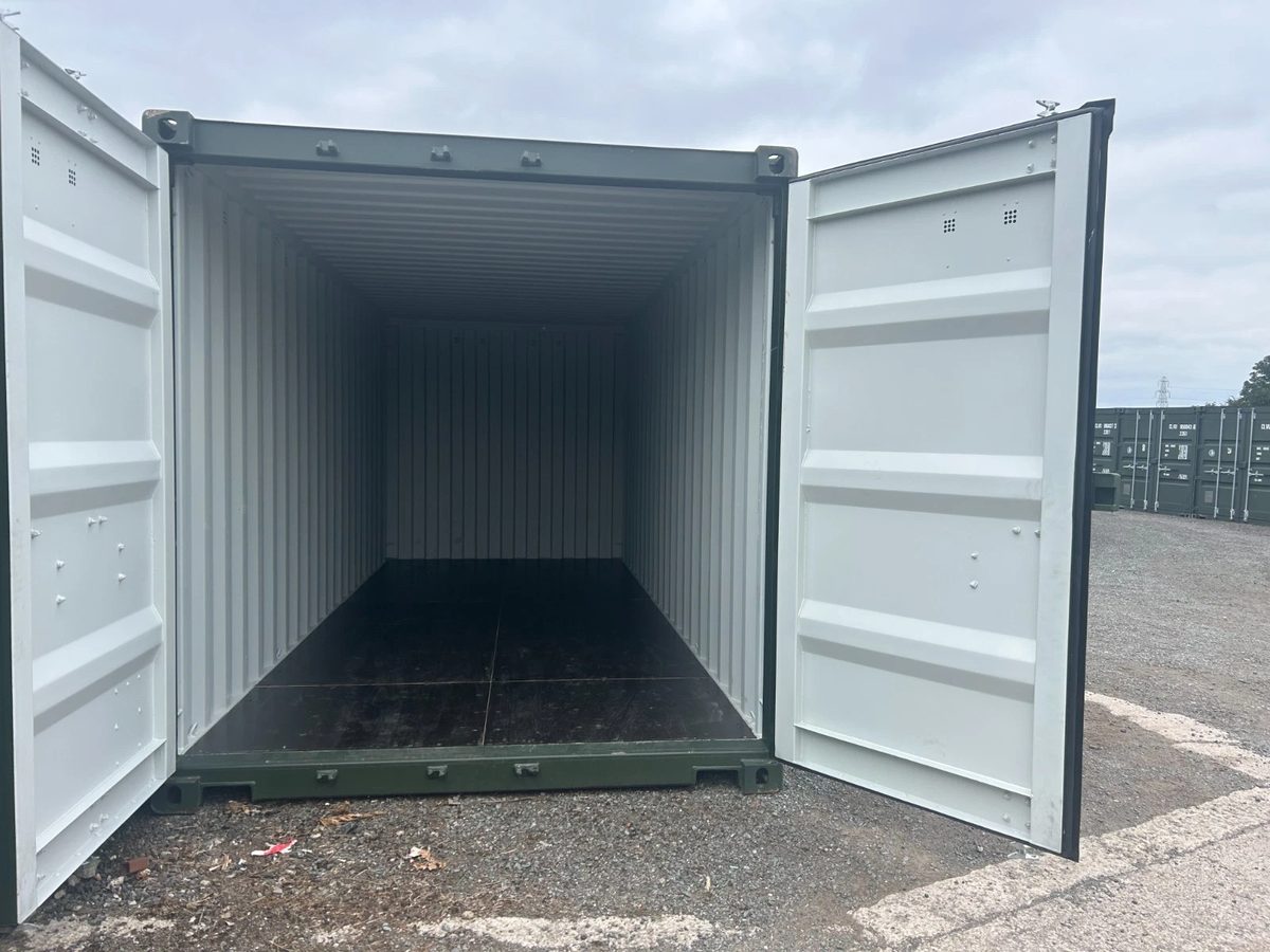 20ft New Shipping Container – One-Trip, Double Doors – open cargo doors revealing empty container with dark flooring (5)