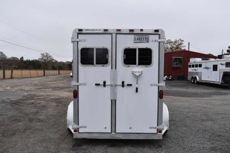 1995 Featherlite 2 Horse Trailer – Aluminum, Dressing Room – Straight rear view of the closed white doors with a license plate visible