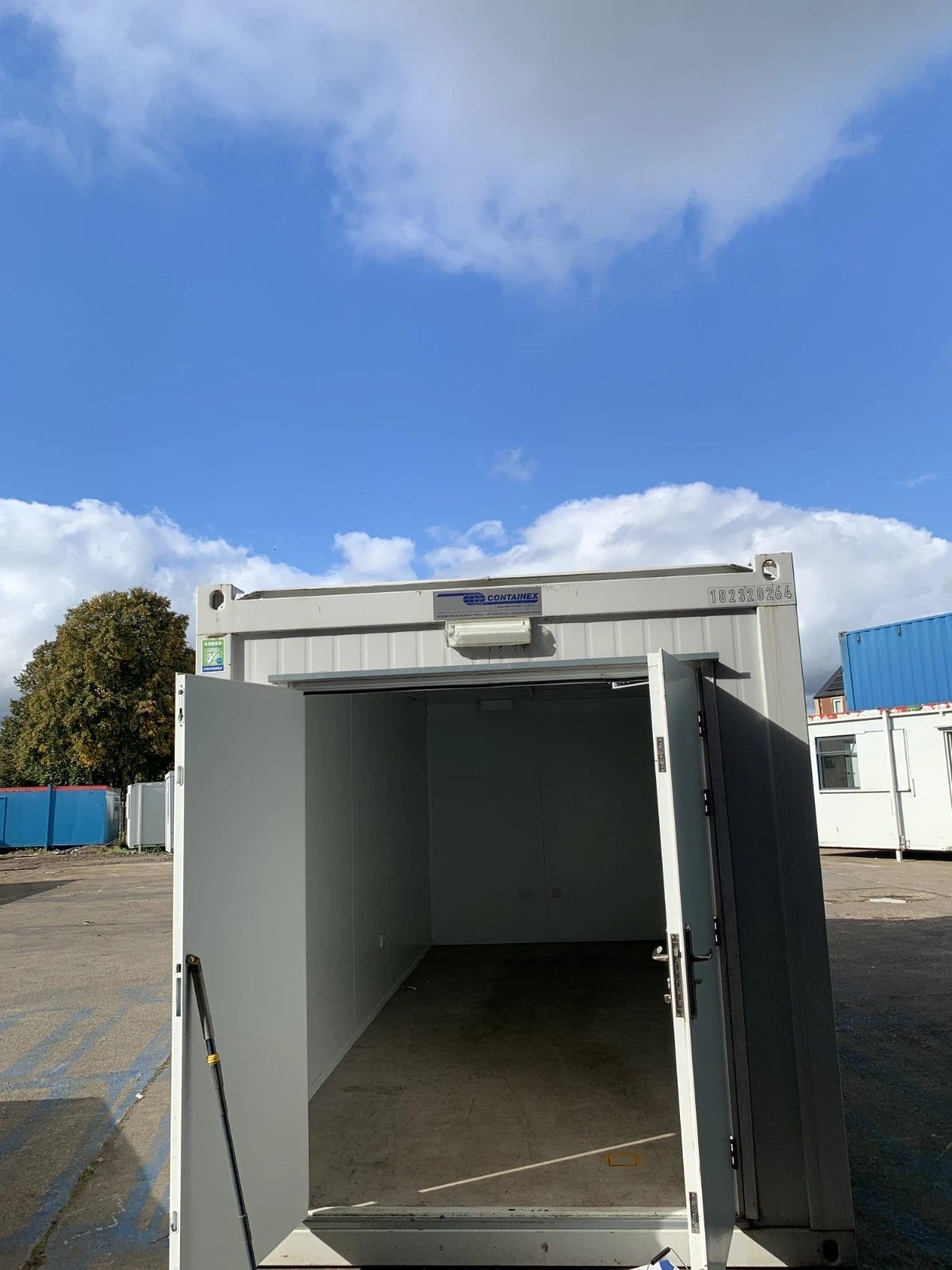 20ft Insulated Storage Container – Lockable Double Doors – open double doors revealing an empty insulated storage unit