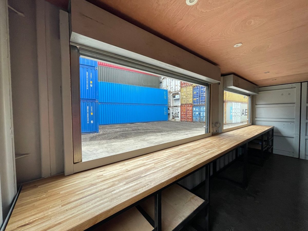 20ft High Cube Container Bar – Multiple Serving Hatches – container bar interior with wooden counter and open serving windows