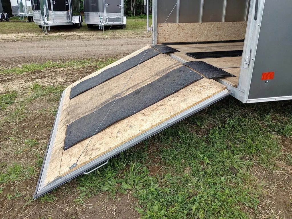 2022 Sno Pro Trailers Hybrid 2.0 – Charcoal Snowmobile Trailer – A side angle view of the lowered rear ramp door with traction mats
