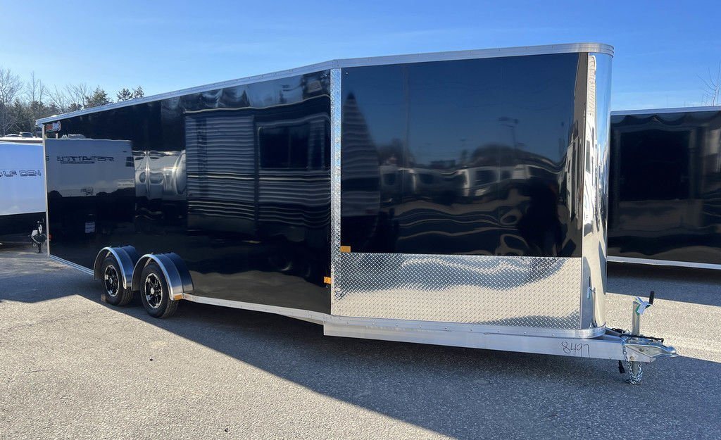 2024 Sno Pro 22 ft Snowmobile Trailer – Extra Height – Profile view of the black trailer showing the tandem axles and front wedge design