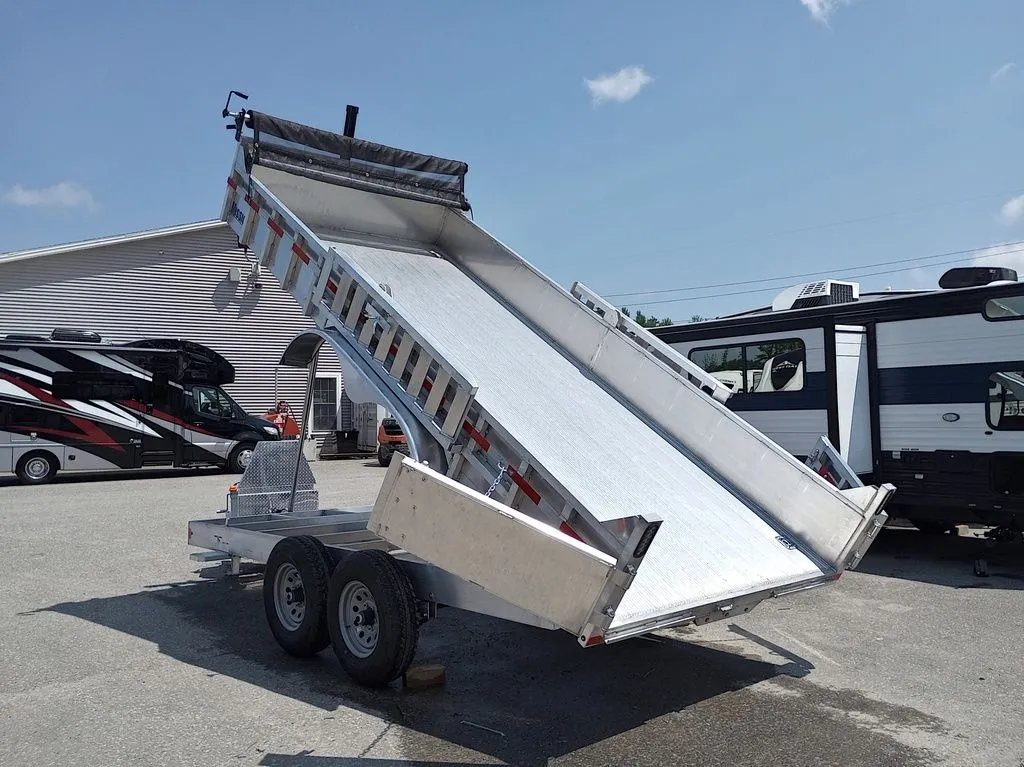 2025 Mission Trailers 16 ft Dump Trailer – Aluminum – Rear three-quarter view of the trailer bed in the tilted position