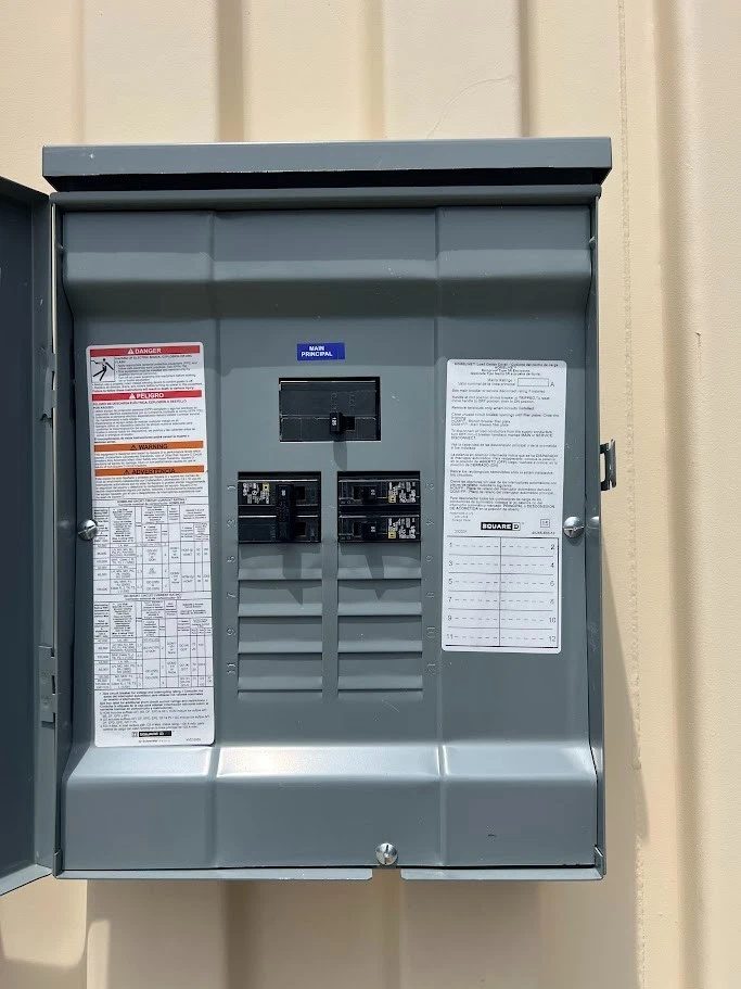 20ft High Cube Container Office – Side Entry and Two Windows – open electrical breaker panel on corrugated exterior wall