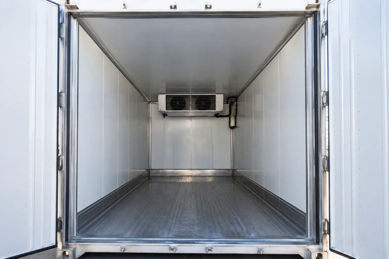 Refrigerated storage container interior prepared for placed in service readiness review